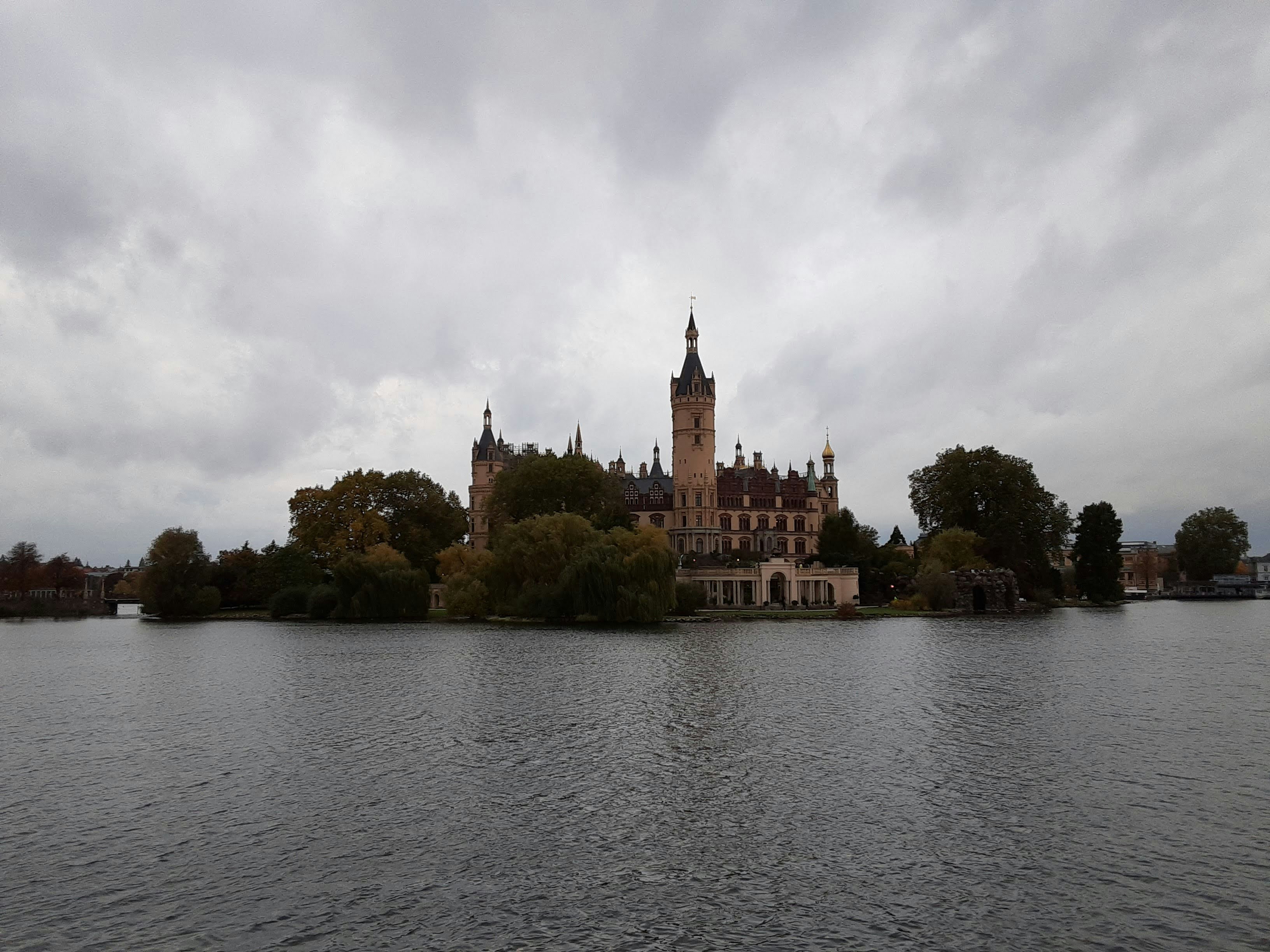 a large building sitting on top of a lake