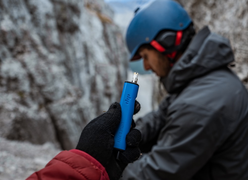 a person wearing a helmet and holding a lighter