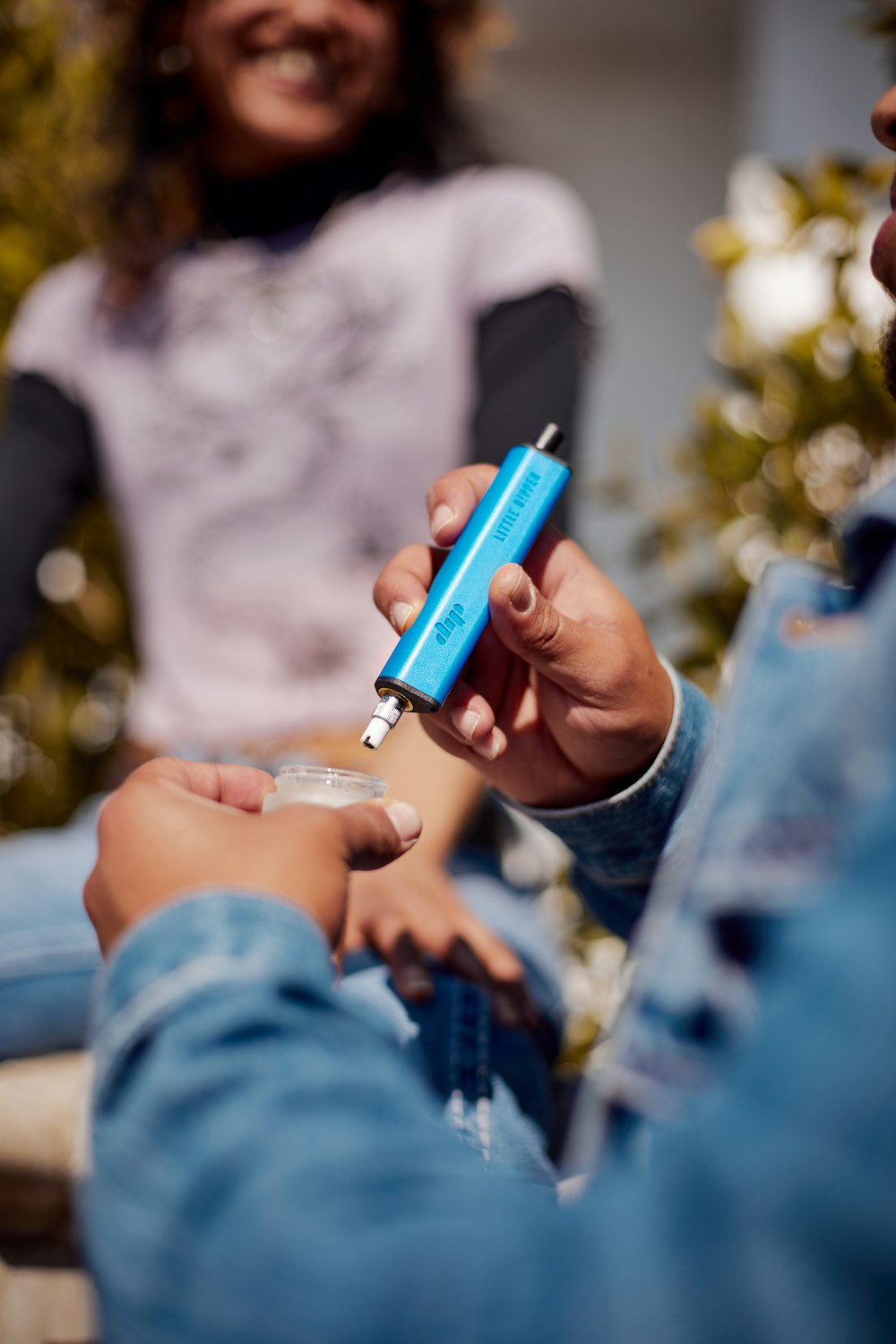 a person holding a lighter in their hand