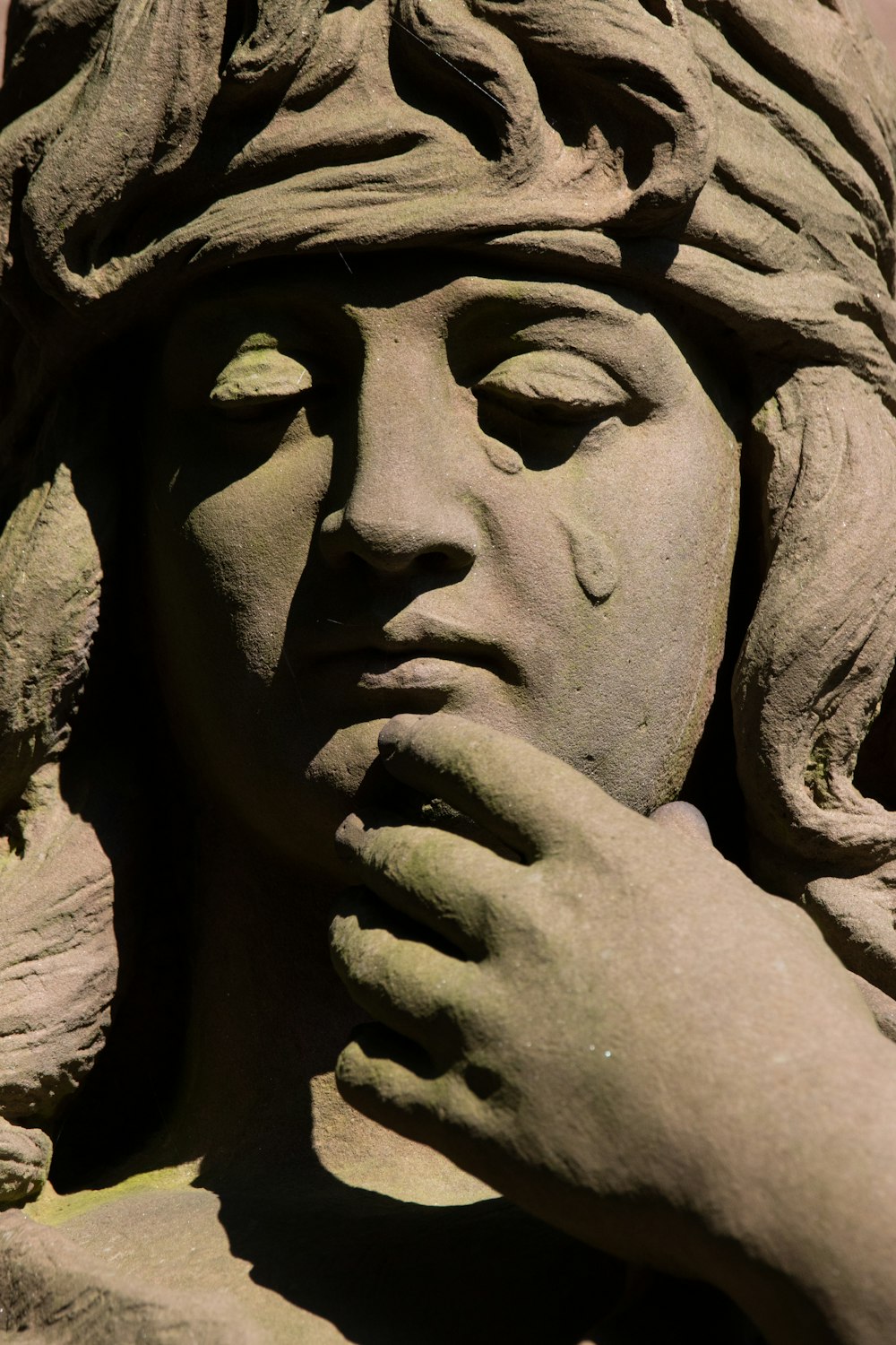 a close up of a statue of a woman