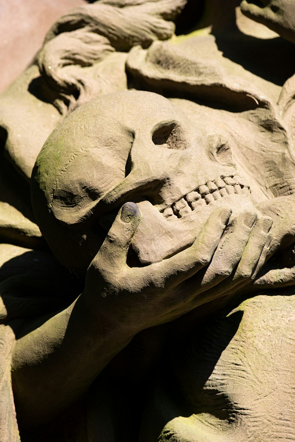 a sand sculpture of a skull with a human face