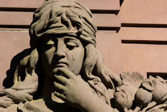 a close up of a statue of a woman