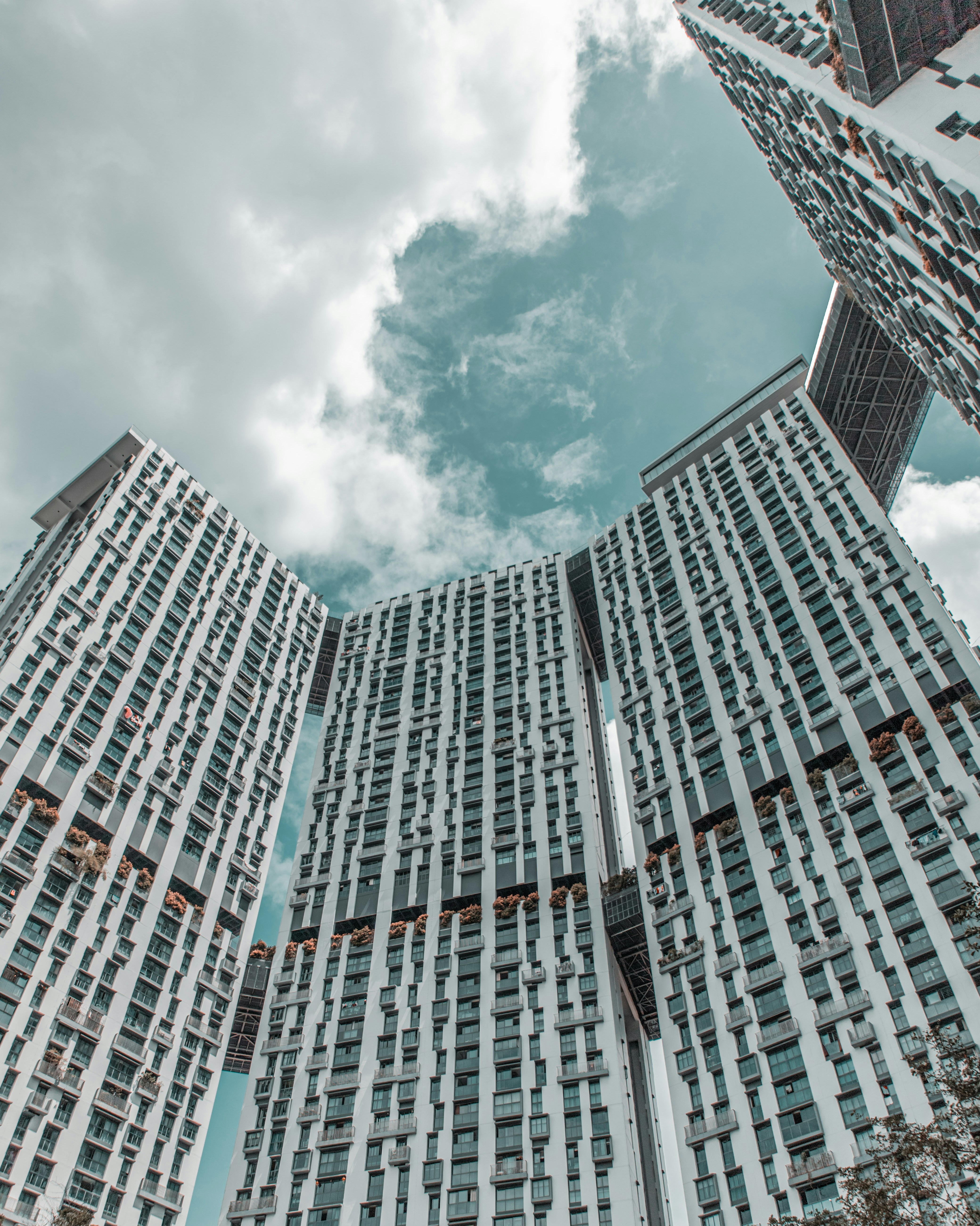 a couple of tall buildings sitting next to each other