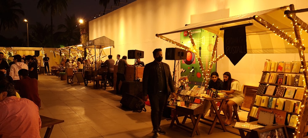 a group of people standing outside of a store