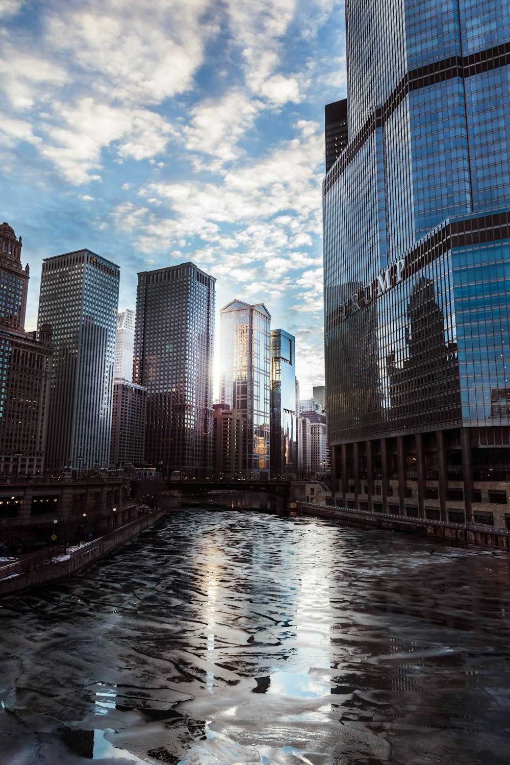 a river running through a city next to tall buildings