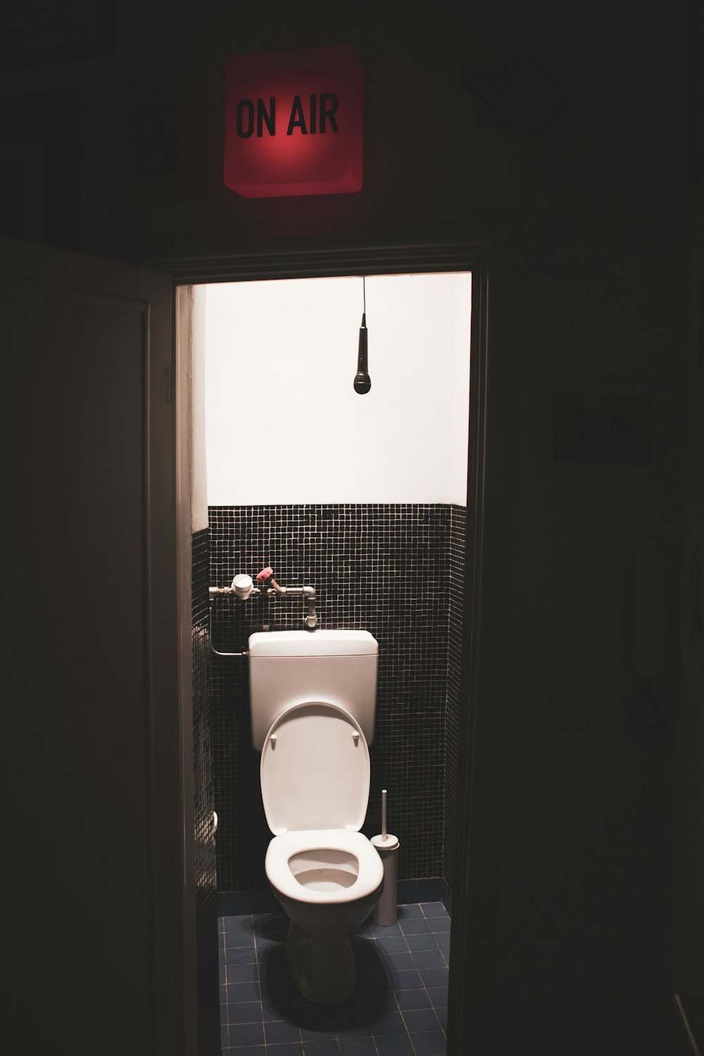 a white toilet sitting inside of a bathroom stall