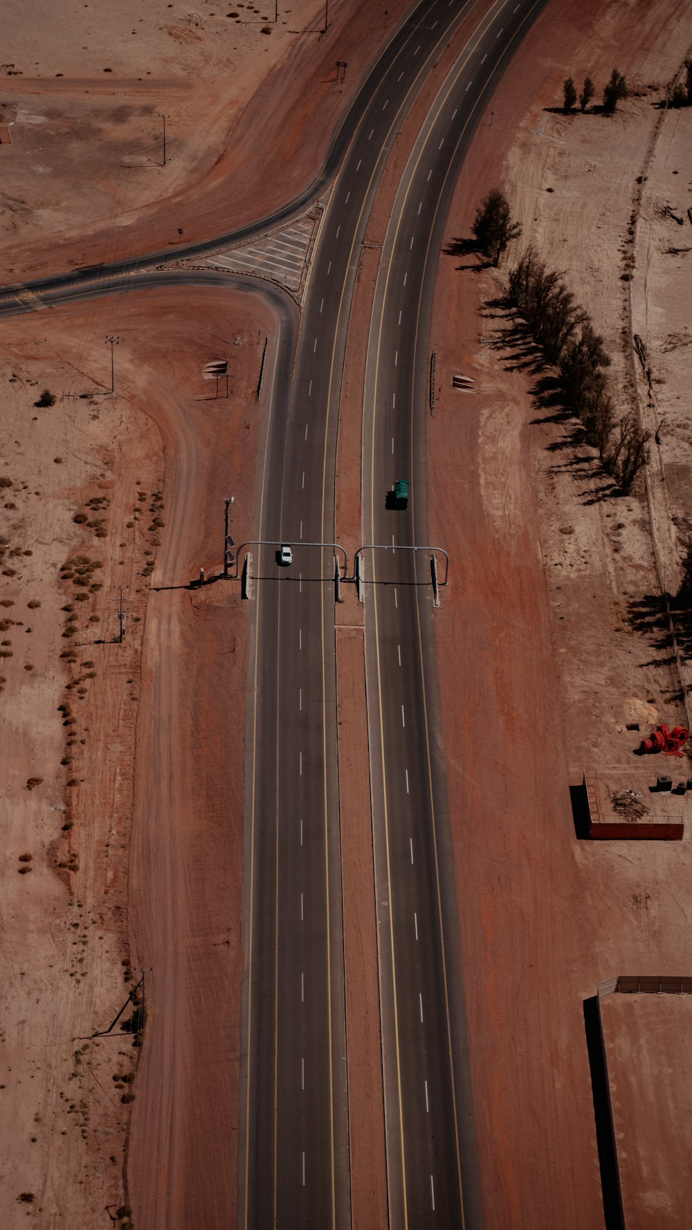 an aerial view of a highway in the desert