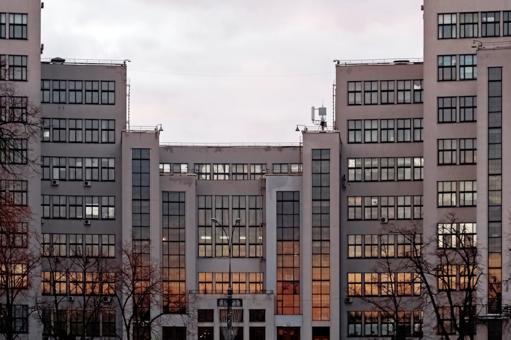 a very tall building with many windows in front of it