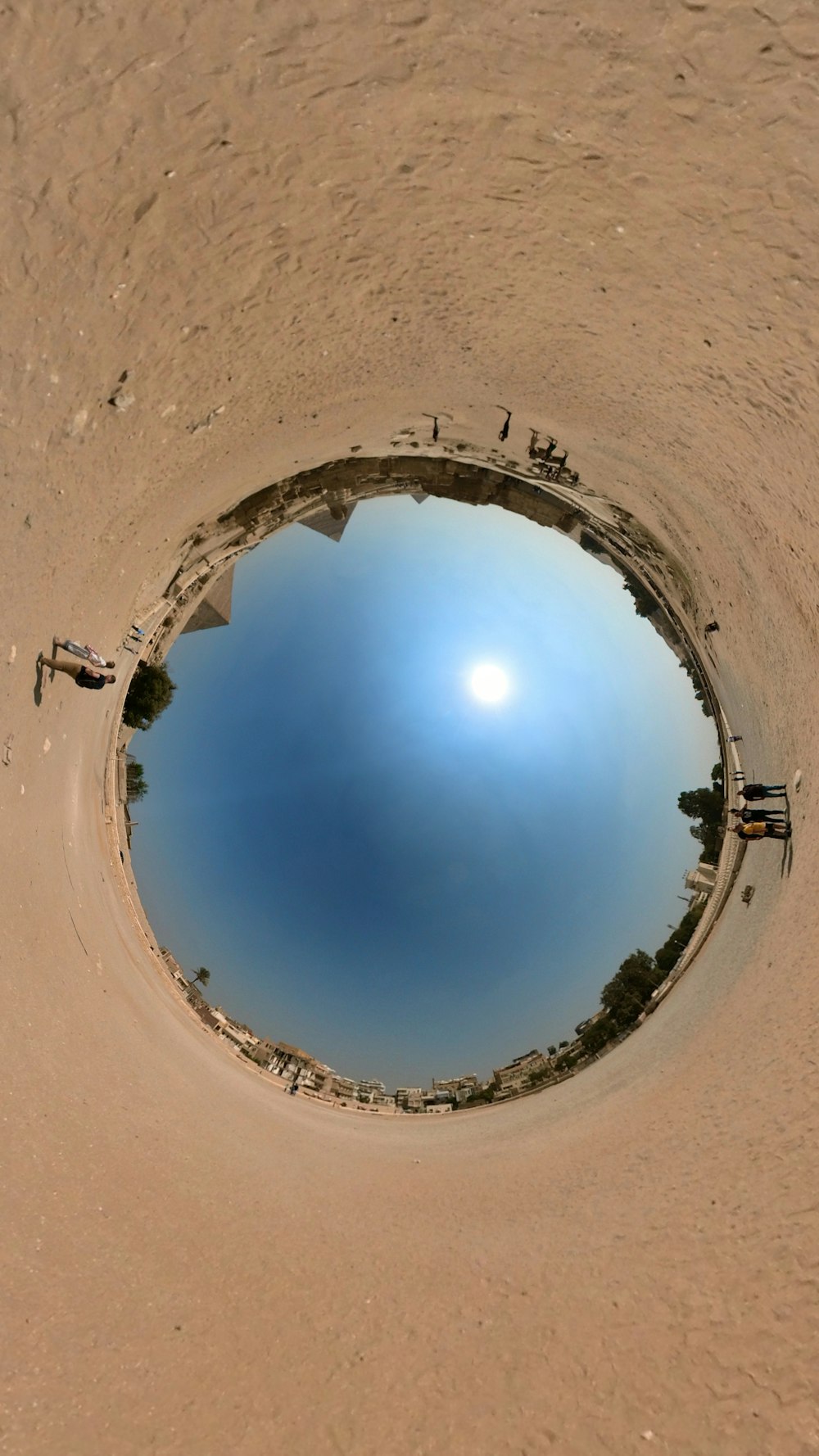 a fish eye view of a sandy beach