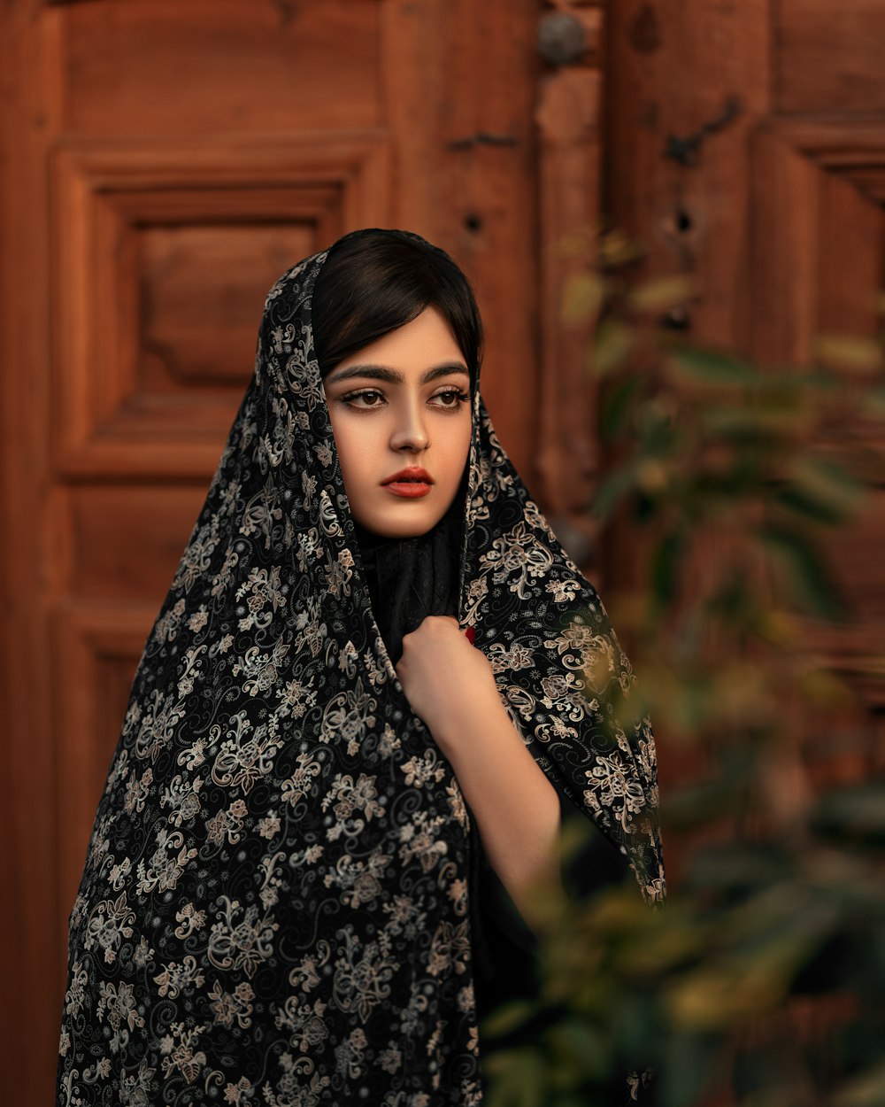 a woman wearing a black and white shawl
