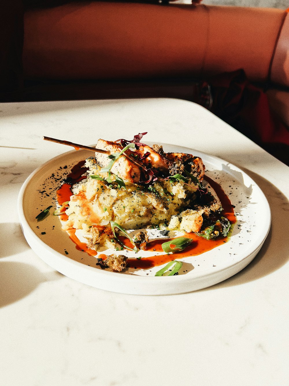 a white plate topped with food on top of a table