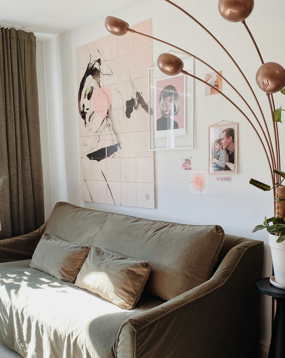 a living room with a couch and a painting on the wall