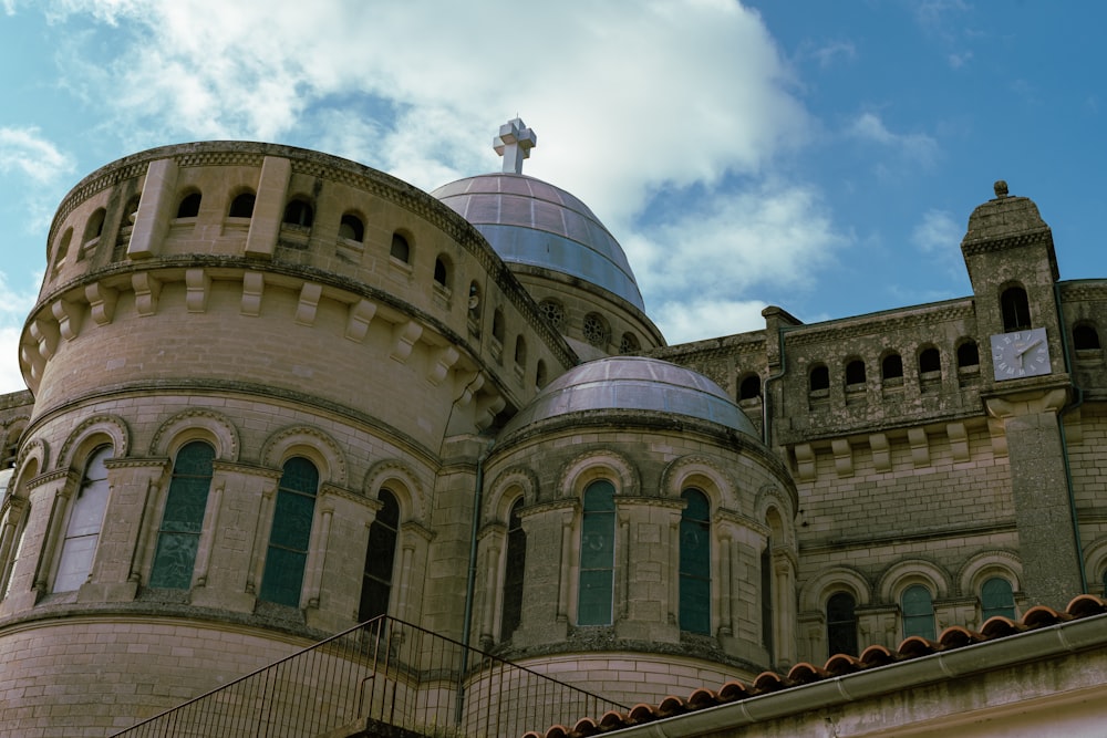 a large building with a cross on top of it