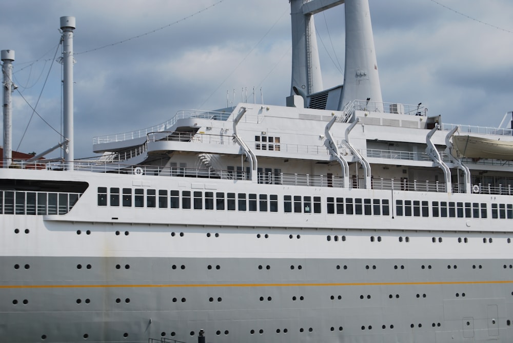 a large white cruise ship in a body of water