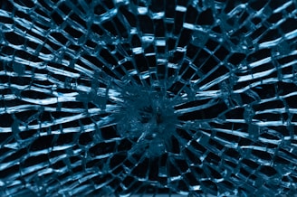 a close up of a broken glass window