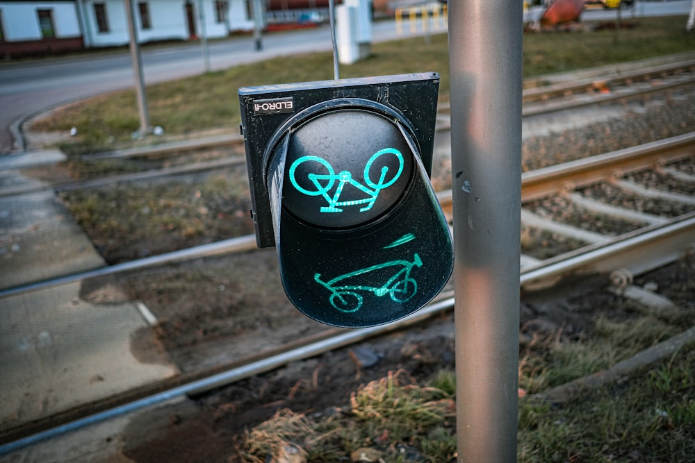 a traffic light that has graffiti on it