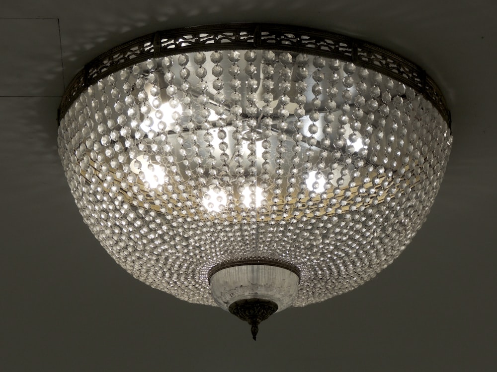 a chandelier hanging from a ceiling in a room