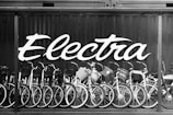 a black and white photo of many bicycles