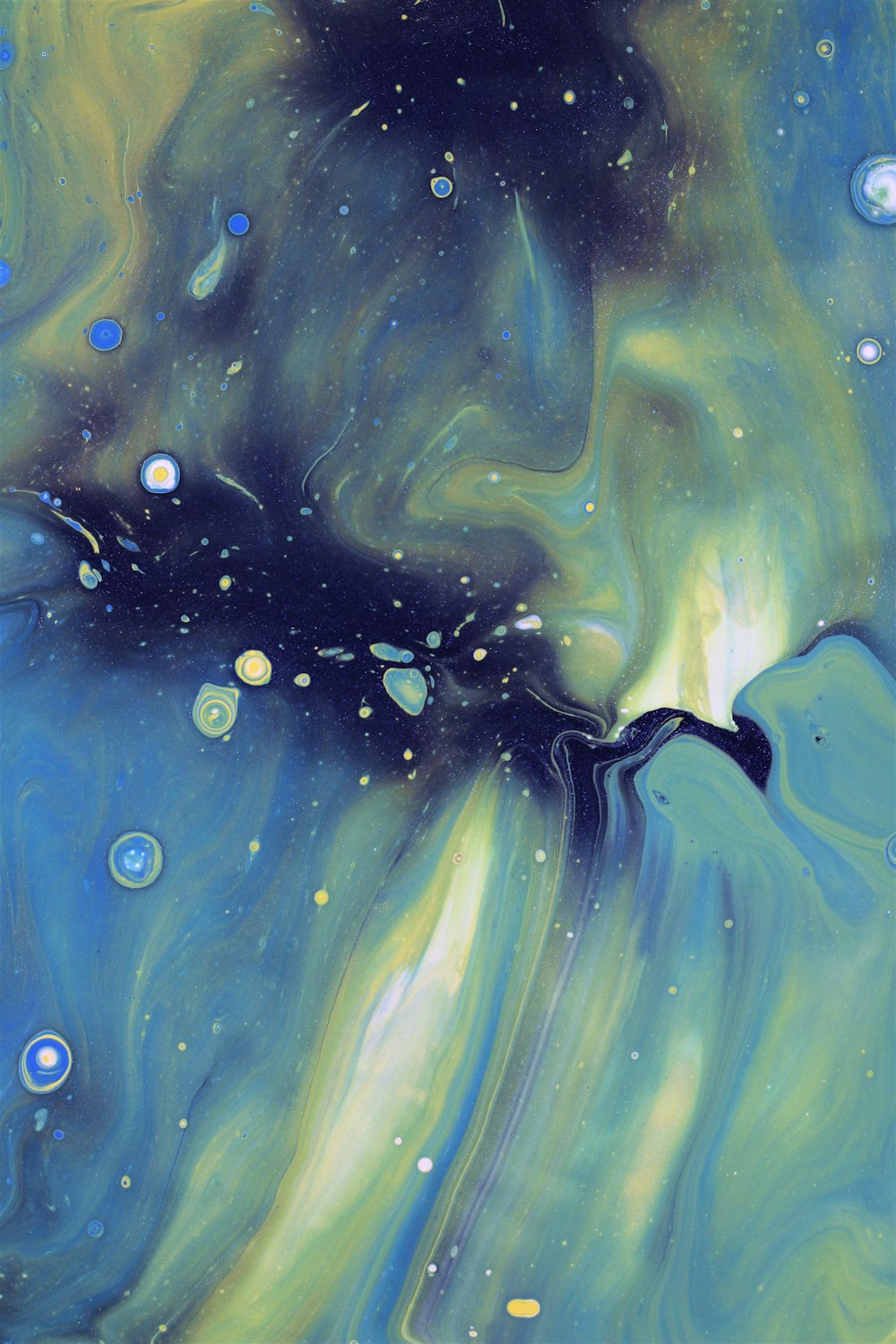 an abstract painting of blue and green colors