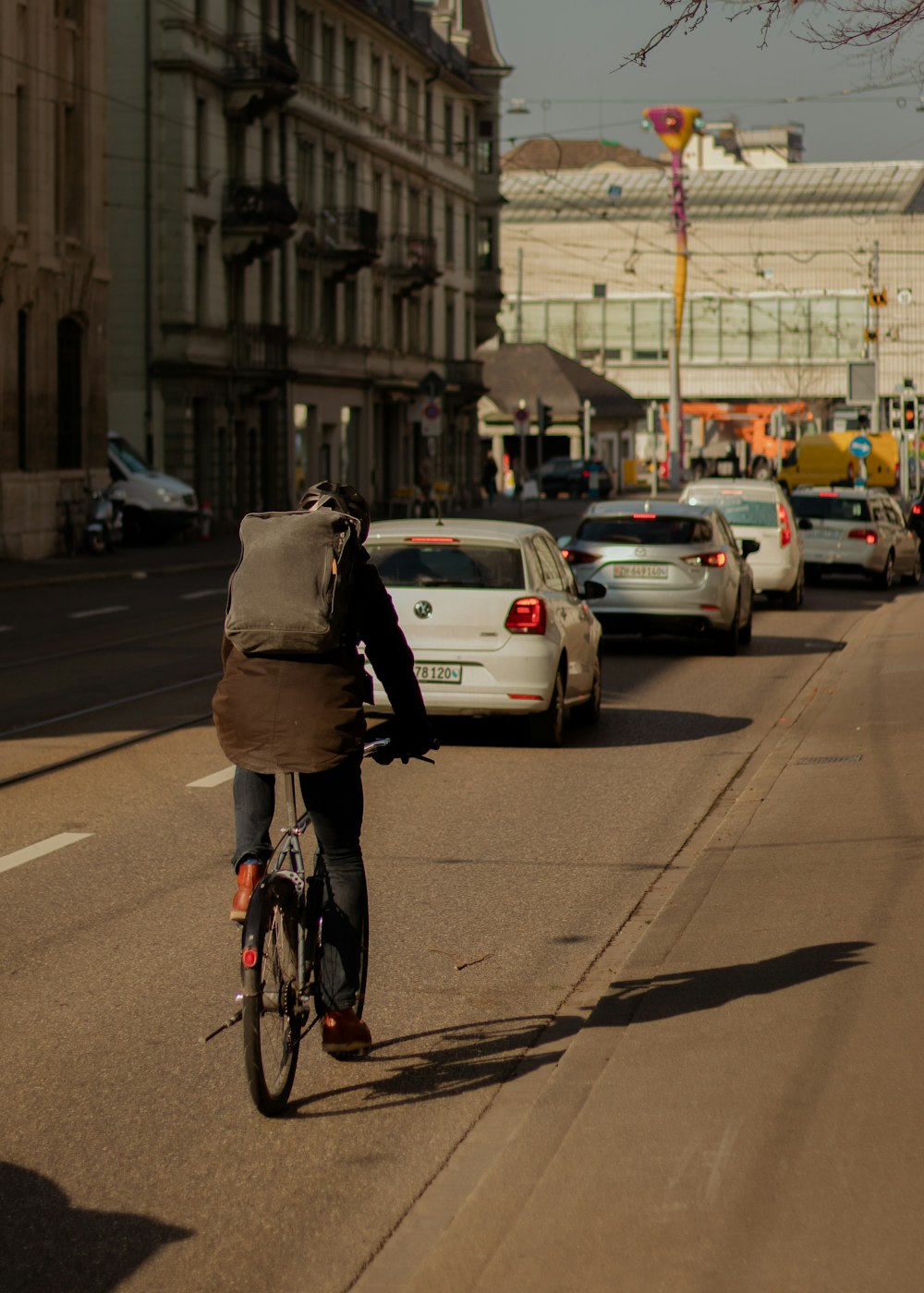 a person riding a bike down a street