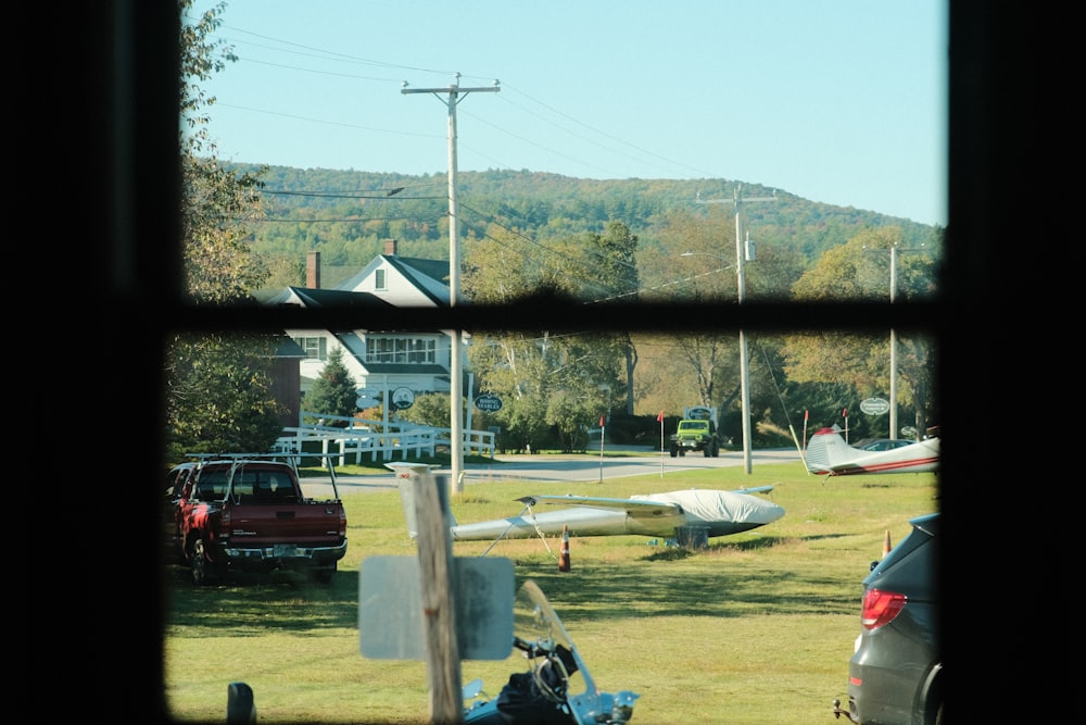 a view from a window of a plane parked in a field