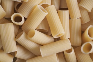 a close up of a pile of pasta shells