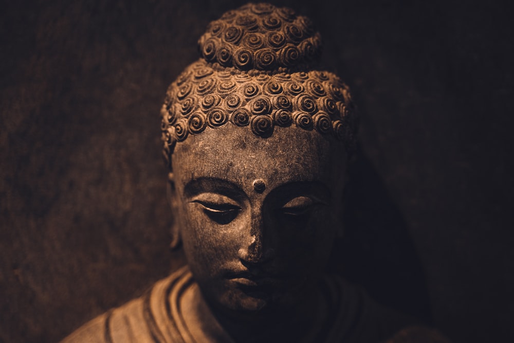 a close up of a statue of a buddha