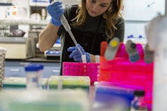 Scientist uses pipette in a laboratory.