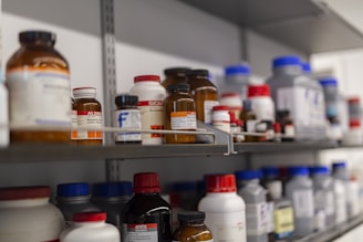 Shelves are filled with various chemical bottles.