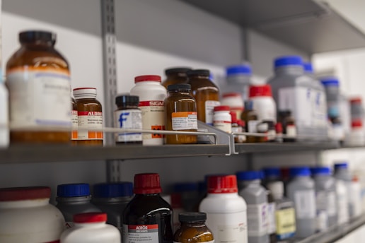 Shelves are filled with various chemical bottles.