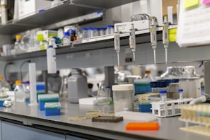 A laboratory bench is full of scientific equipment.