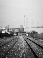 a black and white photo of a train track