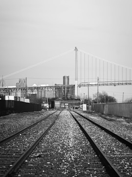 a black and white photo of a train track