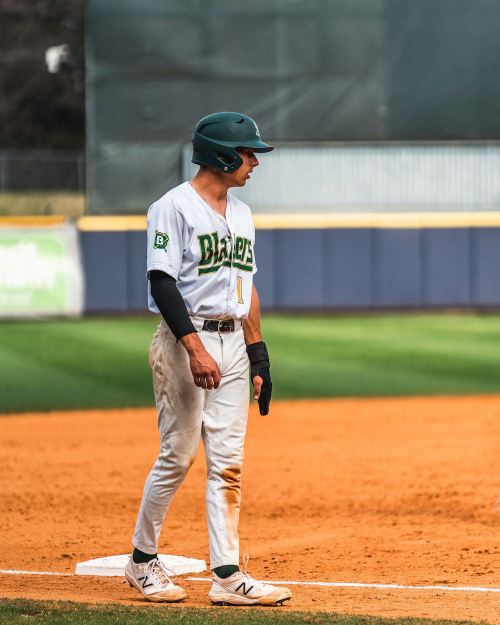 a baseball player standing on a baseball field