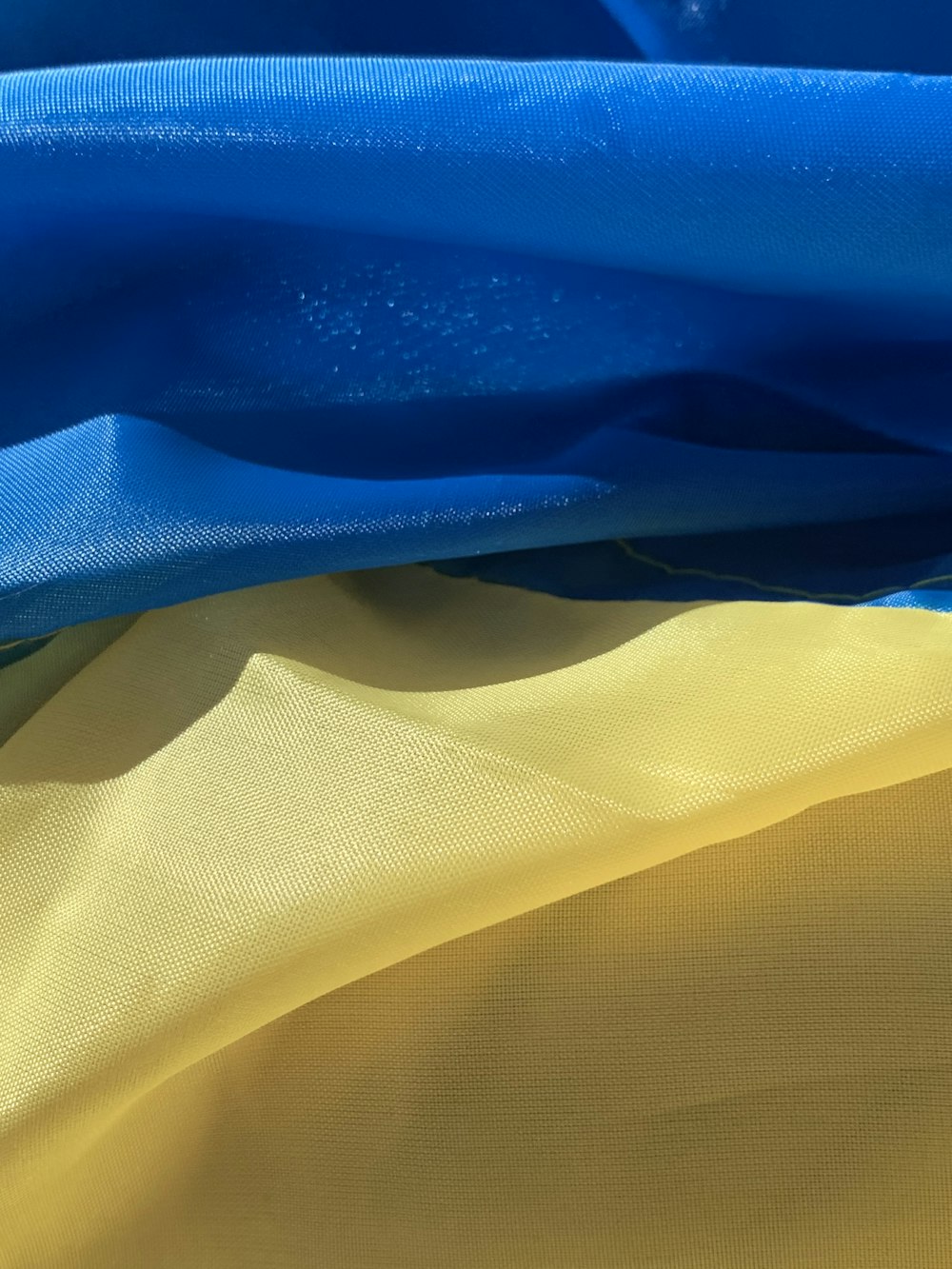 a close up of a blue and yellow fabric