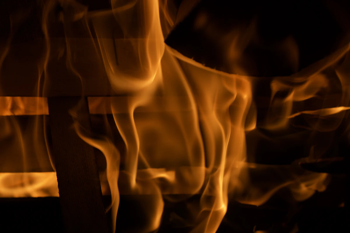 A close-up of burning fire, symbolic of Tapas, disciplined effort