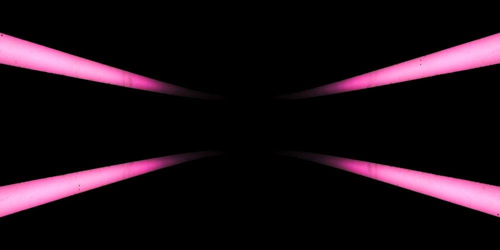 a black background with pink lights in the middle