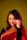 a woman in a red sari posing for a picture