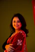 a woman wearing a red scarf and smiling
