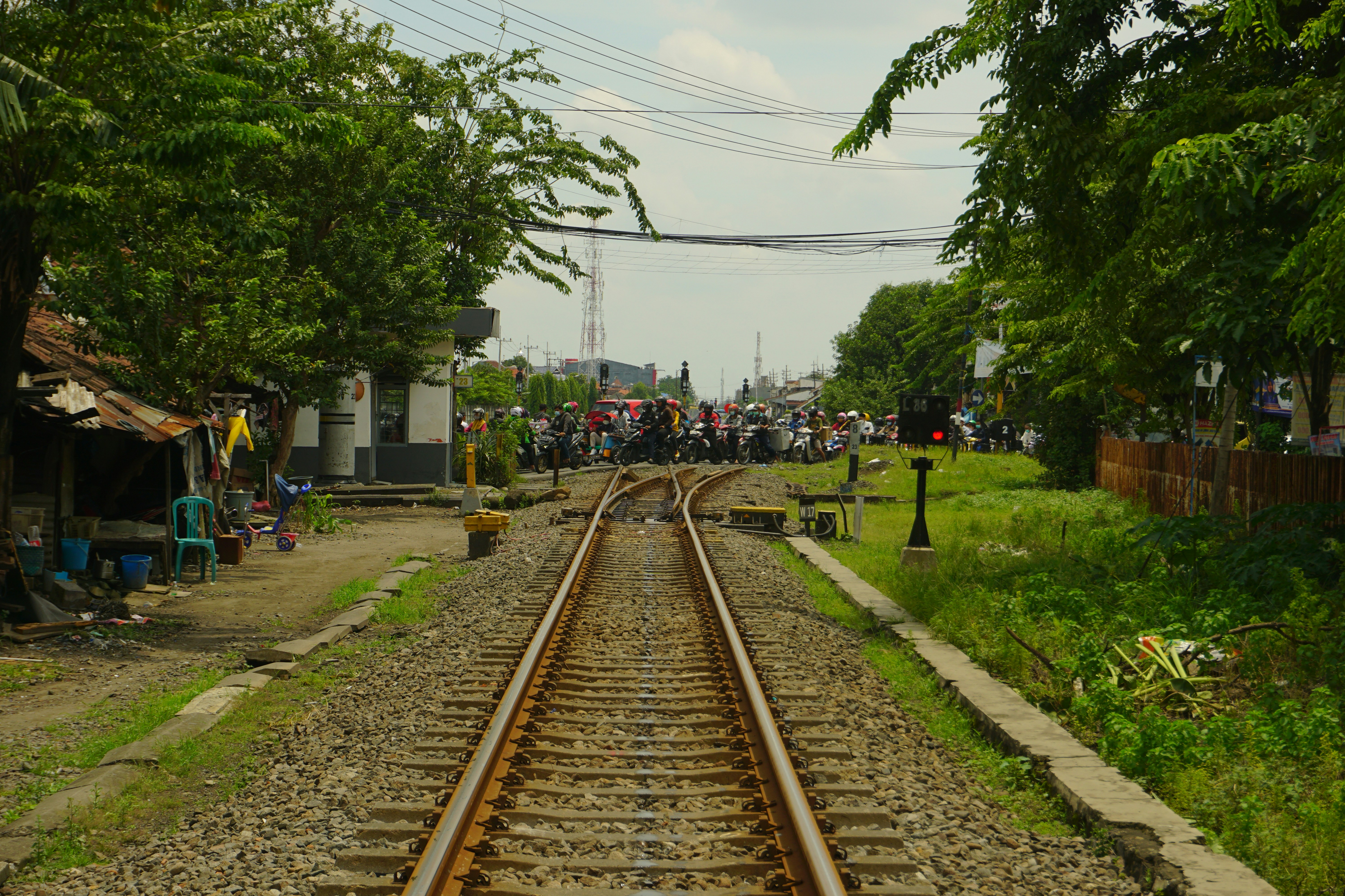 a train track running through a rural area
