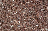a close up of a pile of brown rice