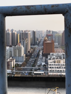 View of multiple urban vision monitors along a city avenue.