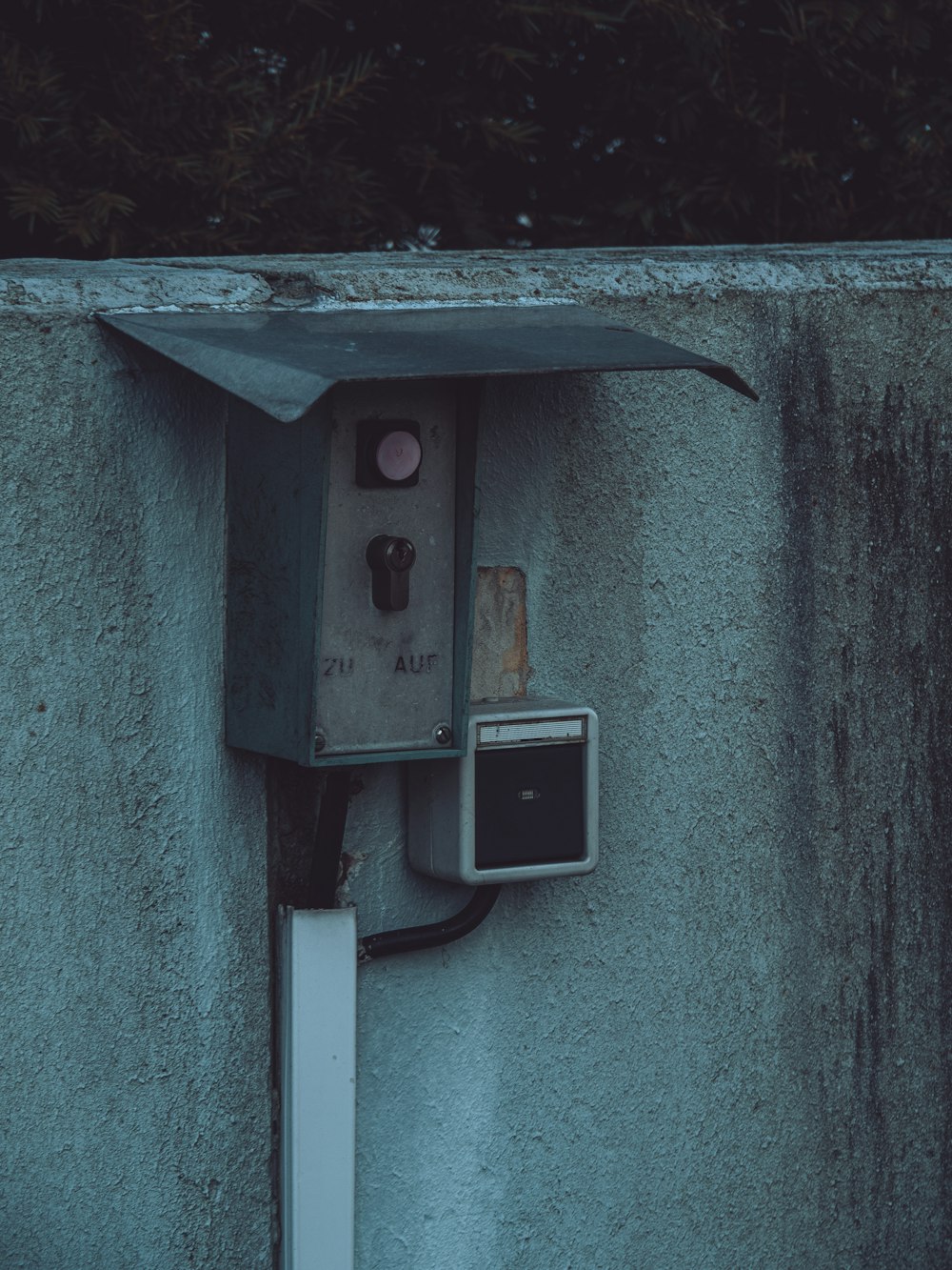 an electrical box attached to a concrete wall