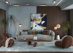 a living room filled with furniture and a painting on the wall