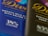 Two chocolate bar wrappers are positioned side by side, one visibly labeled as smooth milk chocolate with salted caramel and the other described as exquisite dark chocolate. Both wrappers feature elegant cursive typography.