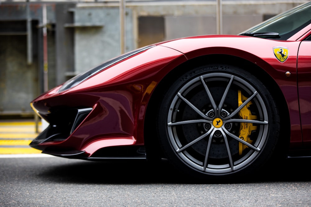 a red sports car parked in a parking lot