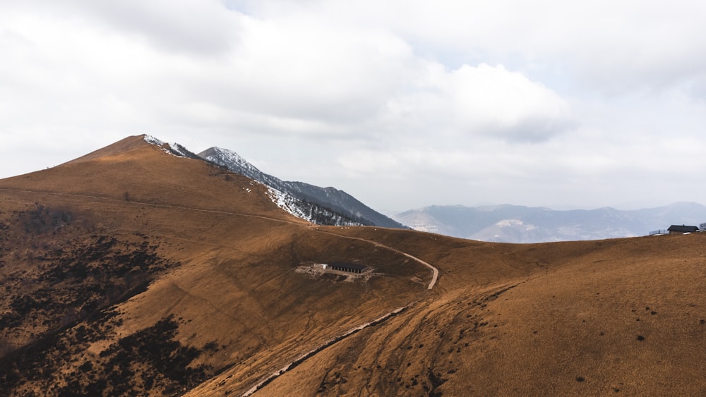 a mountain with a dirt road going through it