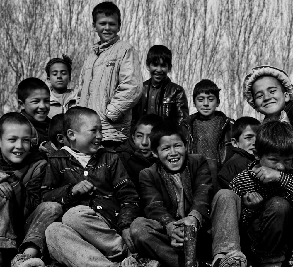 a black and white photo of a group of children