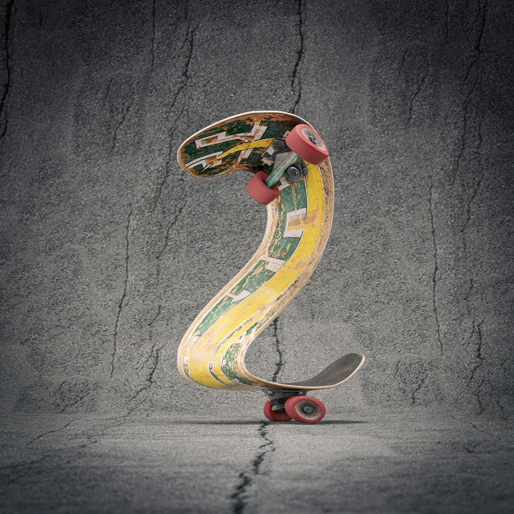 a skateboard with a yellow and green design on it