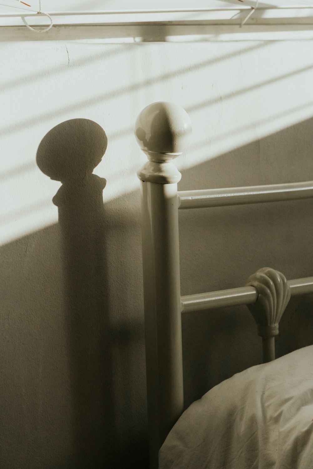 a black and white photo of a bed in a bedroom